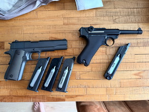 Imagen para Te koop : colt 1911 100th anniversary / luger p08 kwc