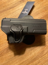 Image for Stoere click holster van Invader Gear voor de Glock