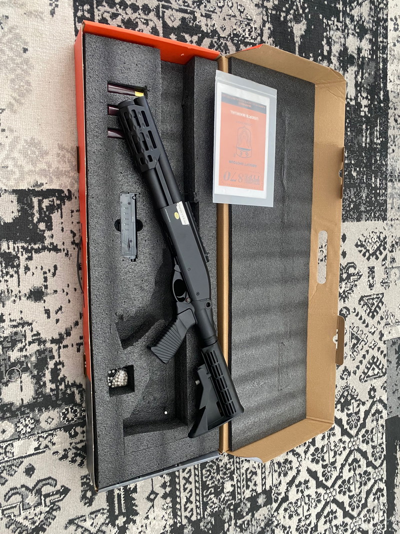 Imagen 1 de M870 Pump Gas Shotgun | Golden Eagle
