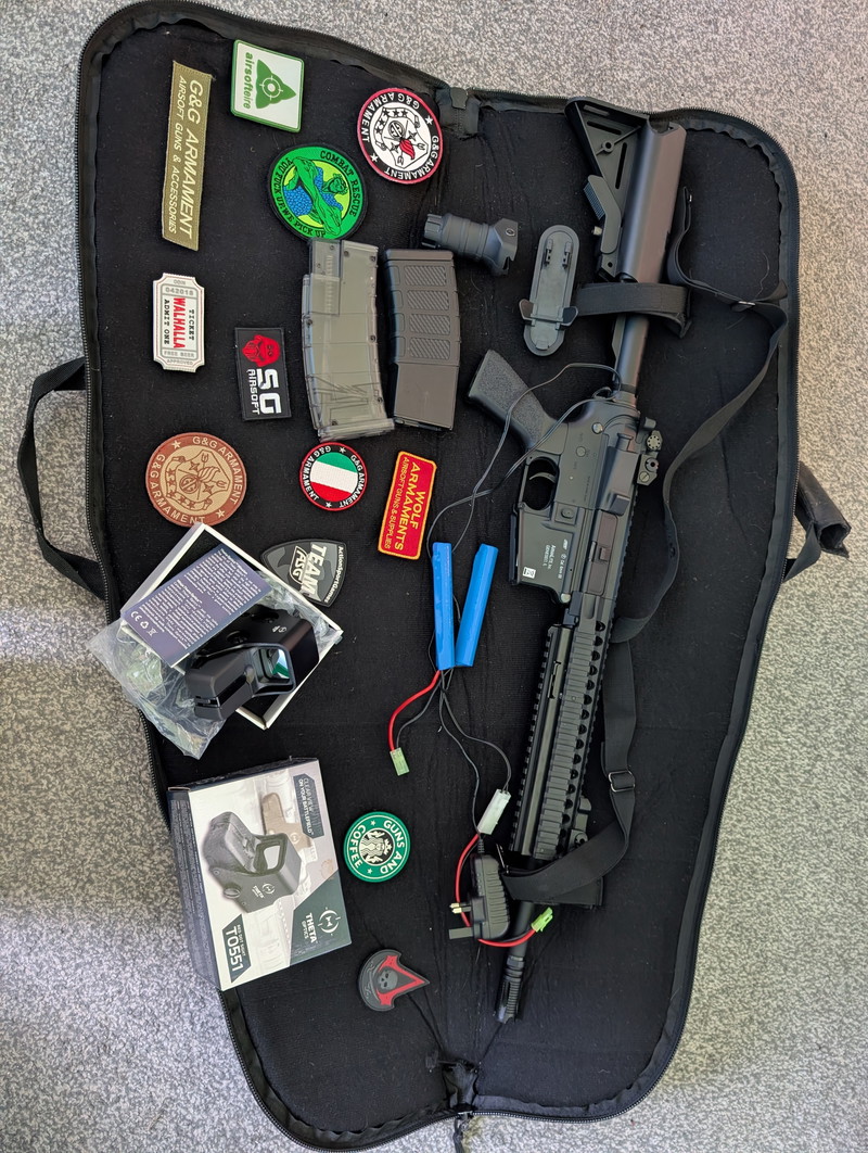 Image 1 for AirsoftM15 armalite ASG included gun bag, badges, scope, sling, BB loader, one magazine, two batteries for scope, charger, battery for gun and BBs with it. Just want to get rid of it asap