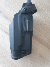 Bild für Safariland holster voor Glock 17/19/23 met wapenlamp. + QLS-vork