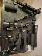 Bild für Sights, grips, silencers, riser, butstock en slingmounts