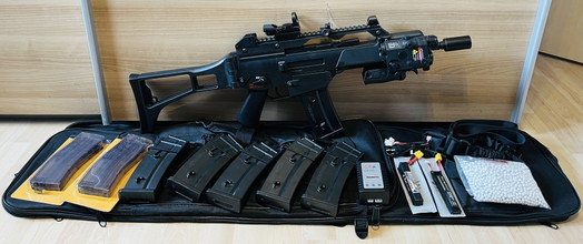 Image for Evolution G36C with internal Tuning Parts 0,49J Set: Airsoft, Tracer, Red Dot (+Protection), High and Mid Cap Magazines, Batteries and Charger, Front Grip, Strap
