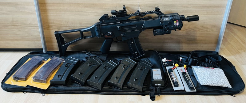 Image 1 for Evolution G36C with internal Tuning Parts 0,49J Set: Airsoft, Tracer, Red Dot (+Protection), High and Mid Cap Magazines, Batteries and Charger, Front Grip, Strap