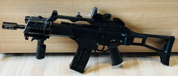 Image 2 for Evolution G36C with internal Tuning Parts 0,49J Set: Airsoft, Tracer, Red Dot (+Protection), High and Mid Cap Magazines, Batteries and Charger, Front Grip, Strap